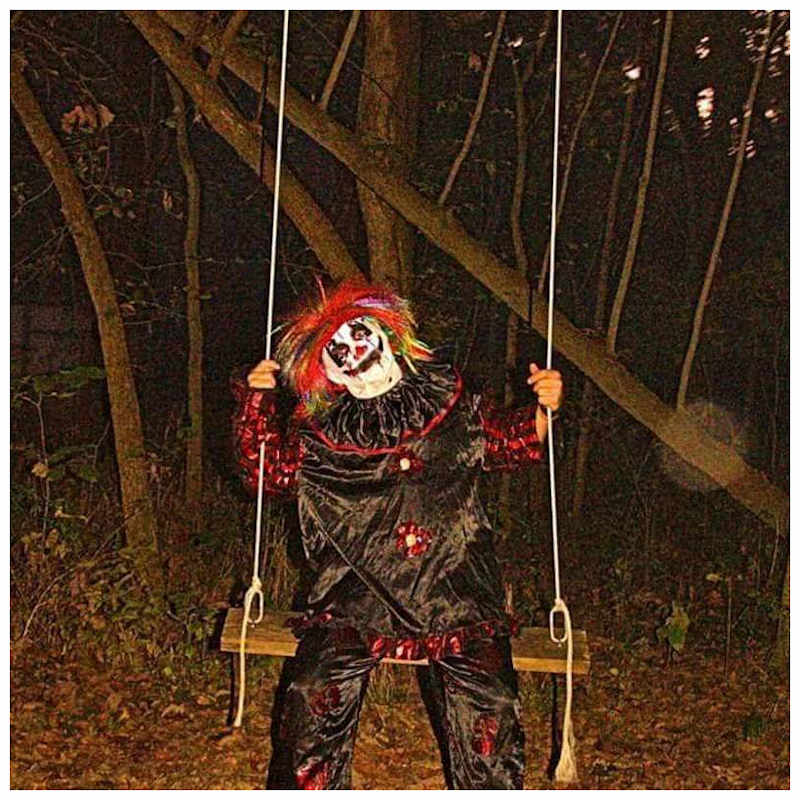 Scary Clown Swinging in the Haunted Woods