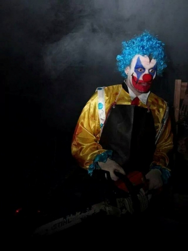 clown with chainsaw