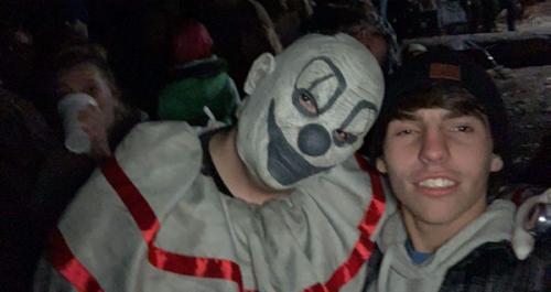 creepy-clown-posing-with-visitor