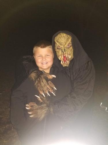 monster-posing-with-guests-outside-haunted-woods-2