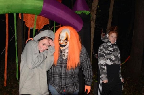 Haunted Woods Clown Comforts Scared Woman