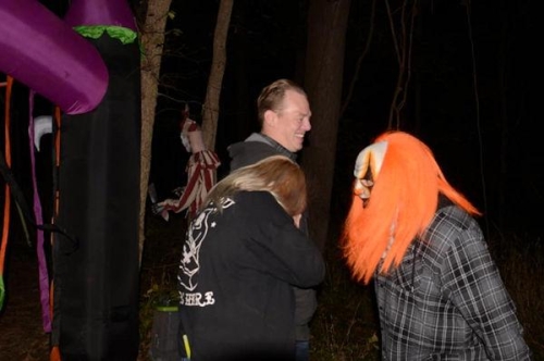 Haunted Woods Scary Clown with Orange Hair and Hiding Woman