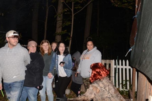 Haunted Woods Clown Monster  and terrified guests