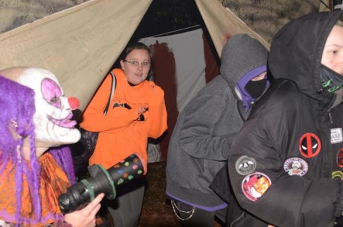 Haunted Woods Clowns Scaring Guests with Horn