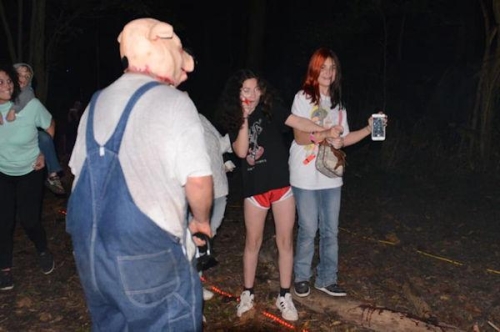 Haunted Woods Pig Man Scaring Girls with Chainsaw