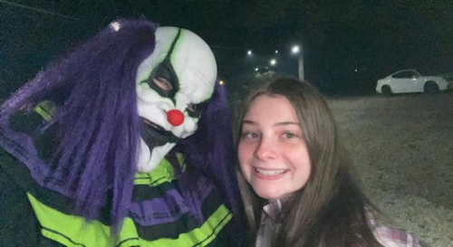 Haunted Woods Purple Hair Clown in Guest Selfie