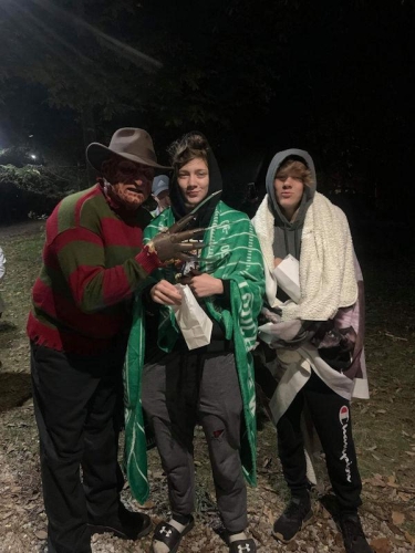 Haunted Woods Freddy Krueger with Scared Guests