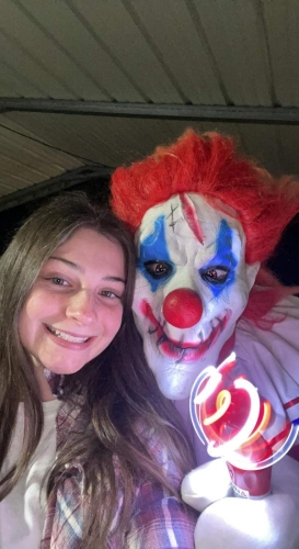 Haunted Woods Smiling Clown in Guest Selfie